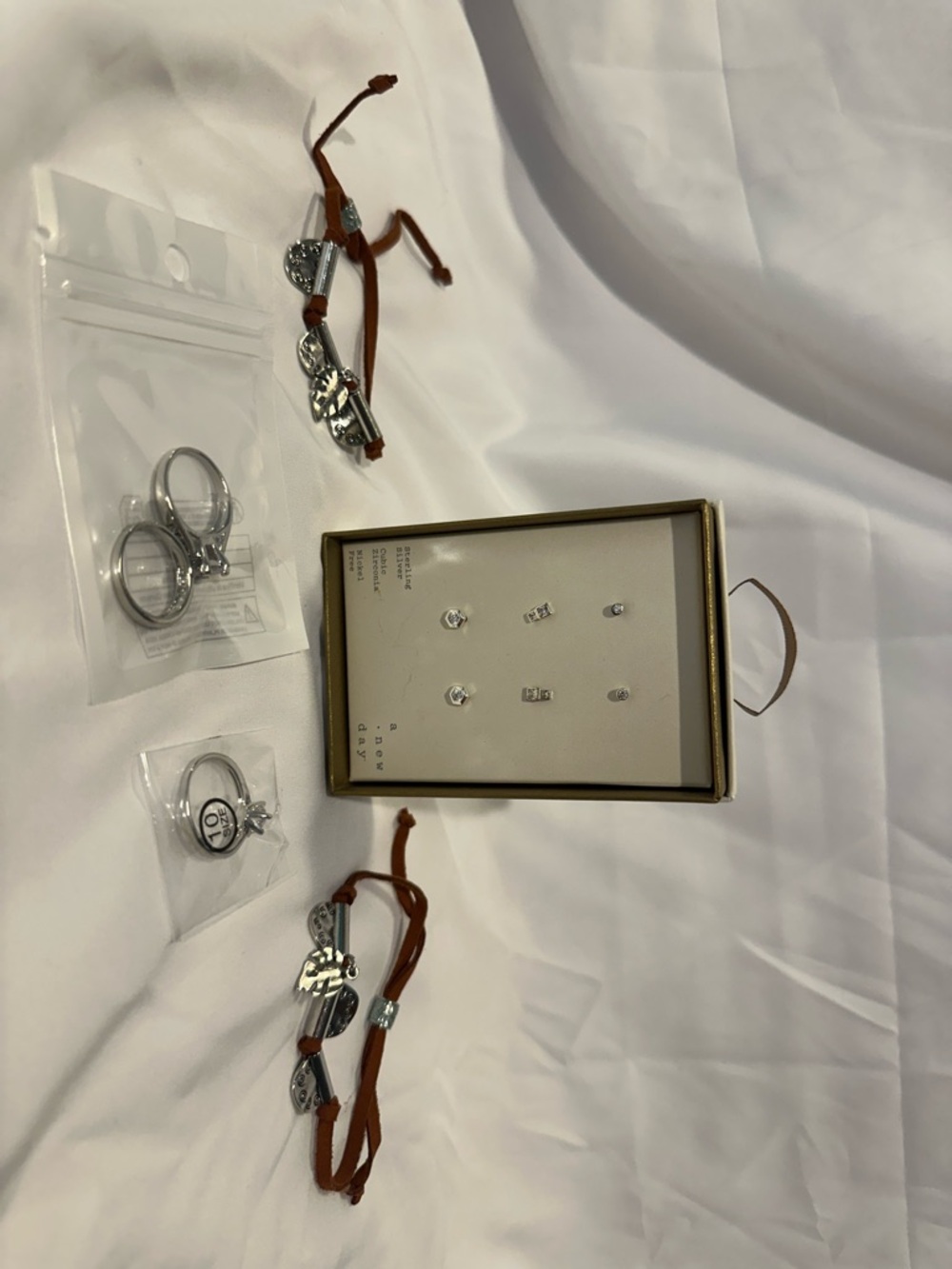 Silver Tone Jewelry Set with Brown Cord Bracelets